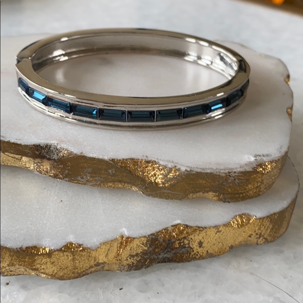 Silver hingged bracelet with blue stones